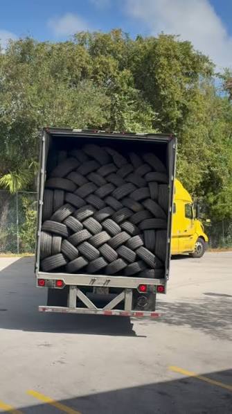 Truck loaded with used tires